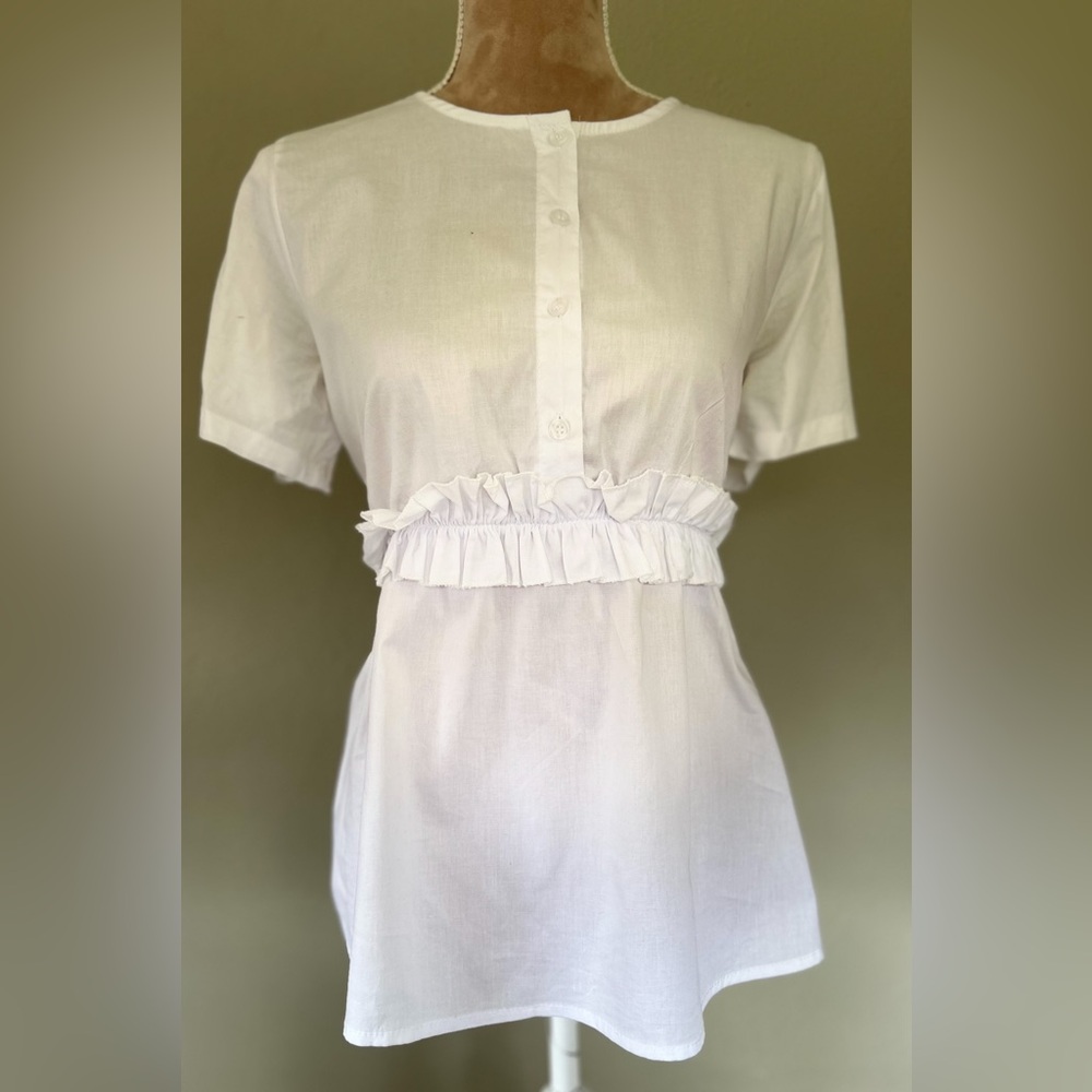 White Top with ruffled accent